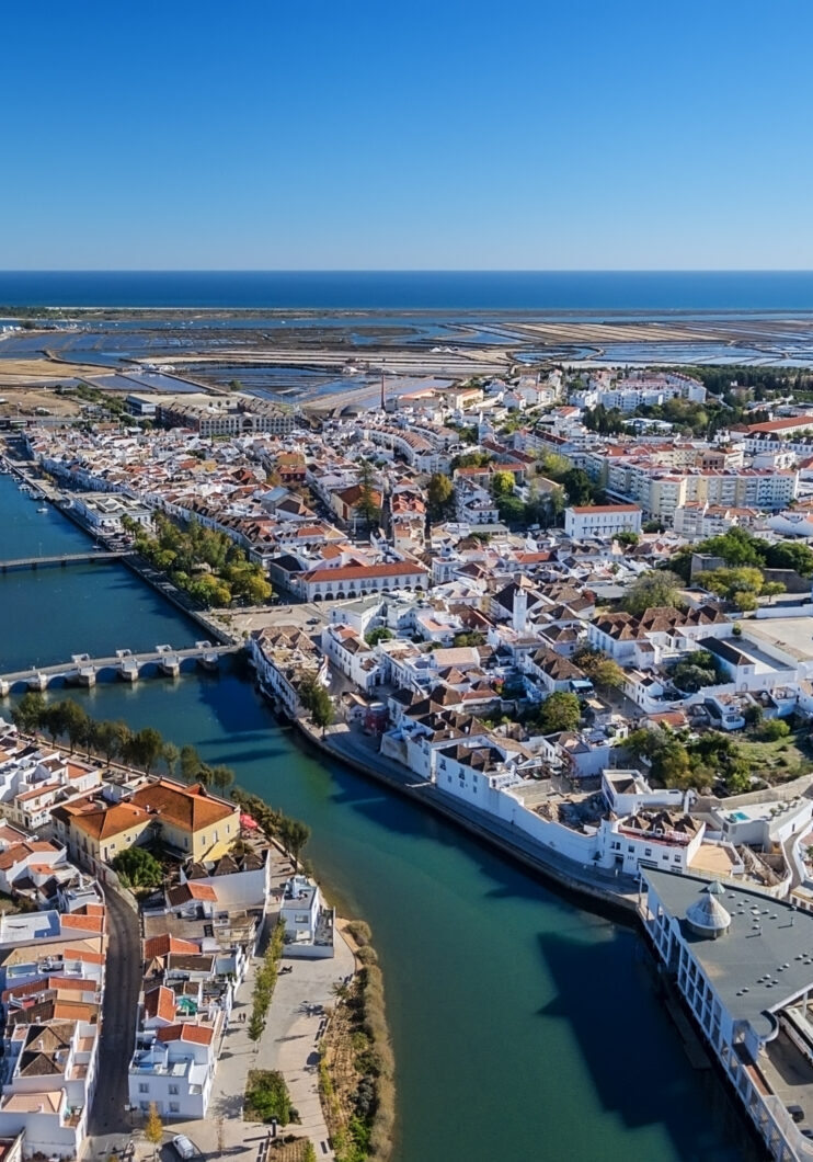 Aerial. The Gilao River and bridges in the city of Tavira.